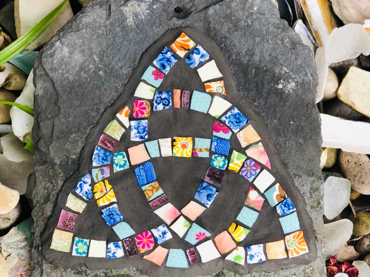 Grouting a mosaic on slate